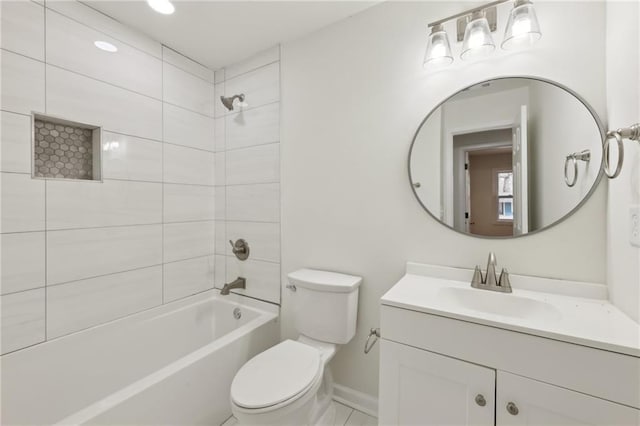 bathroom featuring toilet, baseboards, tub / shower combination, and vanity