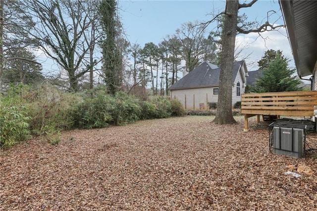 view of yard featuring a wooden deck