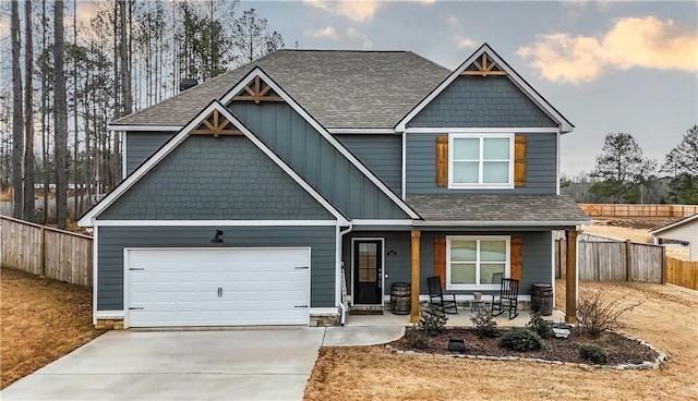 craftsman-style house with covered porch and a garage