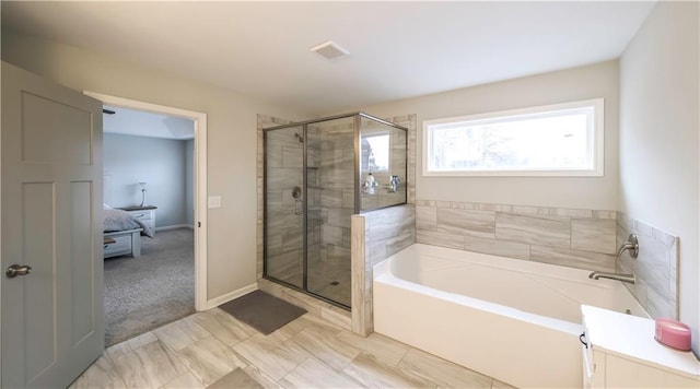 bathroom with separate shower and tub