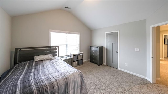 bedroom featuring carpet flooring and vaulted ceiling