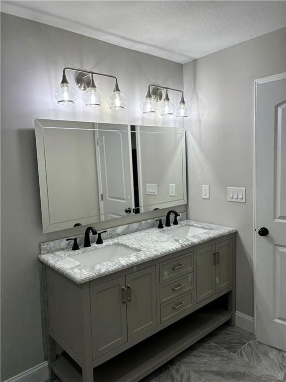 bathroom featuring dual vanity and tile floors