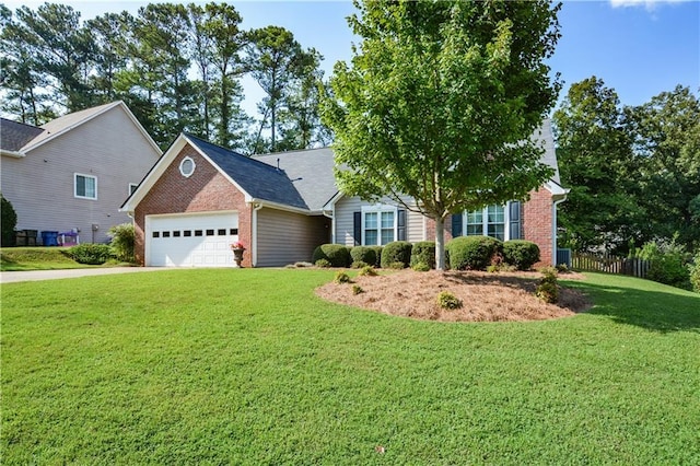 view of front of home with a garage and a front lawn