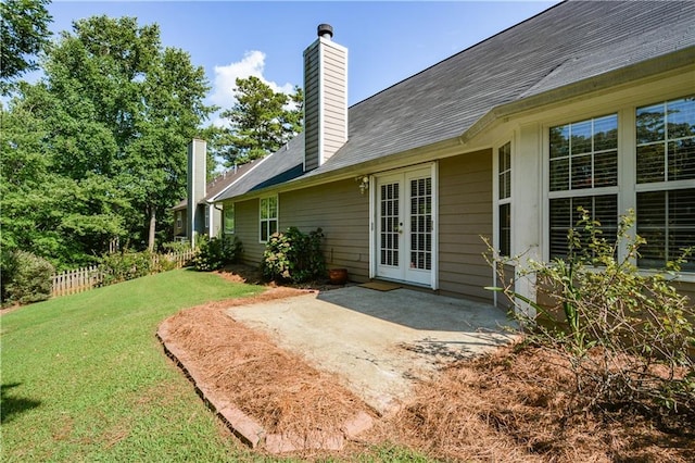 view of yard featuring a patio area and french doors