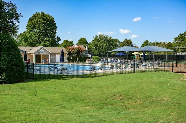 view of swimming pool featuring a lawn