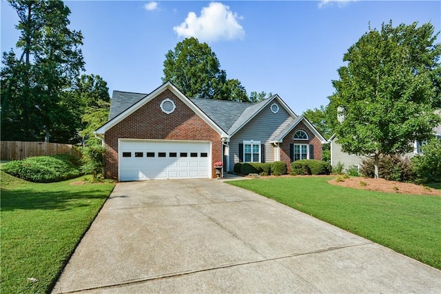 view of front of home featuring a garage and a front yard