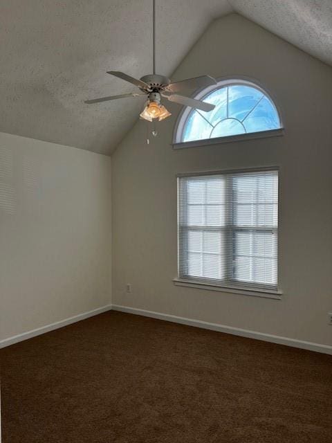 bonus room featuring a textured ceiling, ceiling fan, dark carpet, and vaulted ceiling