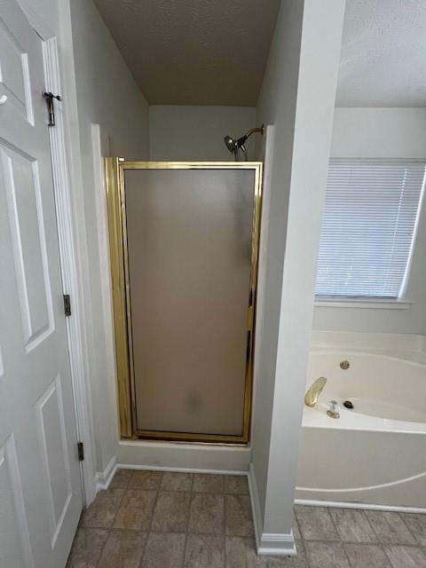 bathroom with shower with separate bathtub