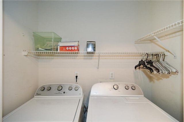 washroom with independent washer and dryer