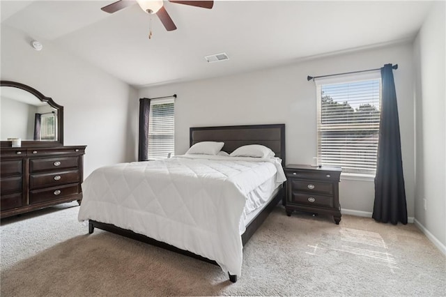 4172 Cedar Commons Way, Conley, GA 30288 - bedroom with light colored carpet, multiple windows, a ceiling fan, baseboards, and vaulted ceiling