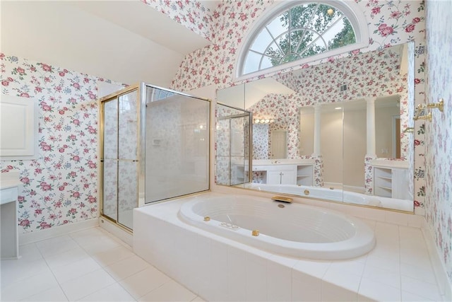 bathroom featuring separate shower and tub, tile patterned flooring, and decorative columns