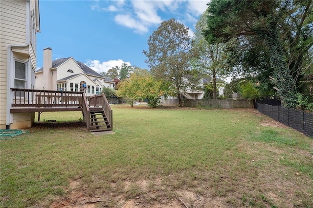 view of yard featuring a wooden deck