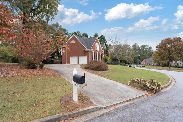 view of front facade with a garage and a front yard