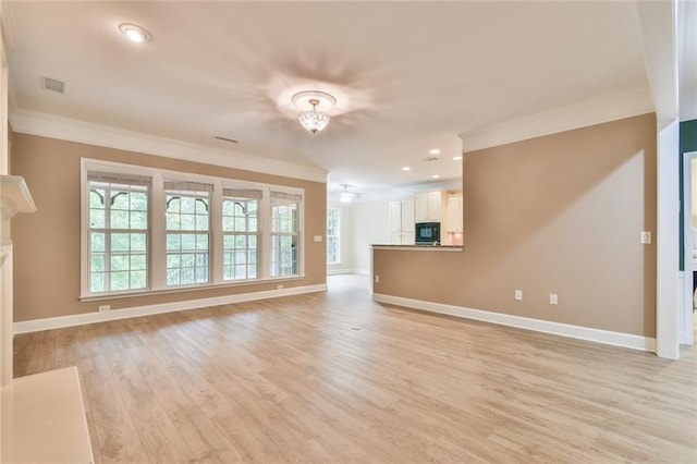 6714 Amherst Dr, Hoschton, GA 30548 - unfurnished living room with ornamental molding, baseboards, light wood-style flooring, a chandelier, and recessed lighting