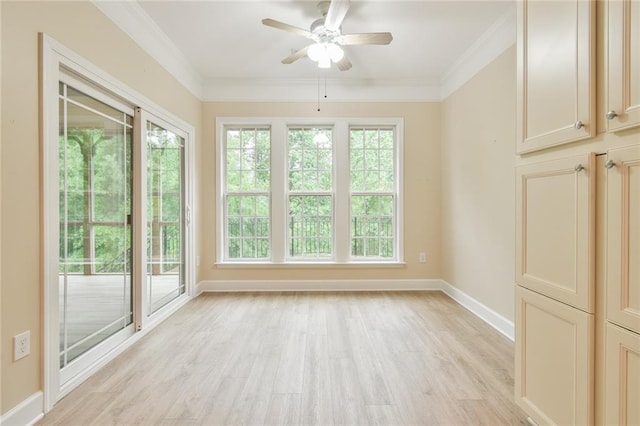 6714 Amherst Dr, Hoschton, GA 30548 - unfurnished room with light wood-style flooring, baseboards, a ceiling fan, and crown molding