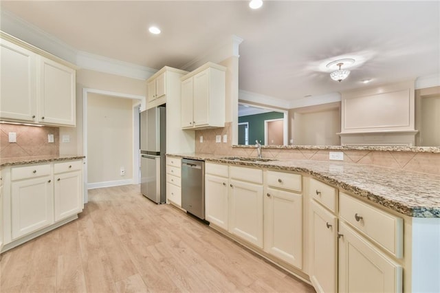 6714 Amherst Dr, Hoschton, GA 30548 - kitchen featuring appliances with stainless steel finishes, a sink, decorative backsplash, ornamental molding, and recessed lighting