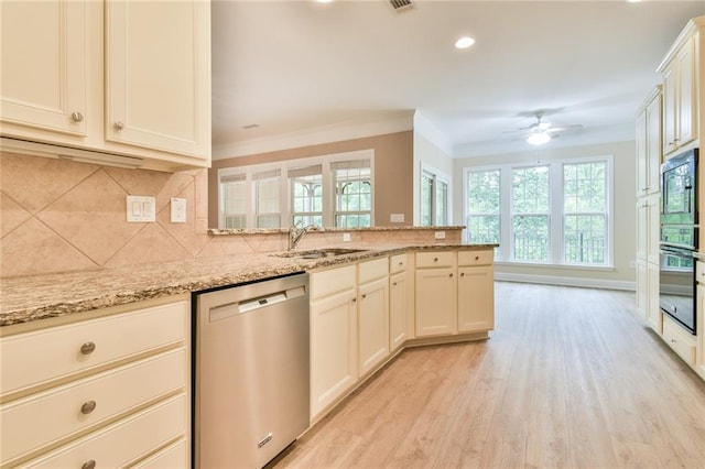 6714 Amherst Dr, Hoschton, GA 30548 - kitchen with appliances with stainless steel finishes, a sink, light wood finished floors, a peninsula, and ornamental molding