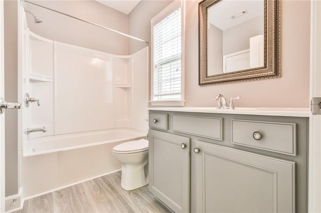 6714 Amherst Dr, Hoschton, GA 30548 - full bathroom featuring vanity, bathtub / shower combination, toilet, and wood finished floors