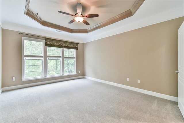6714 Amherst Dr, Hoschton, GA 30548 - unfurnished room with crown molding, a raised ceiling, a ceiling fan, carpet floors, and baseboards