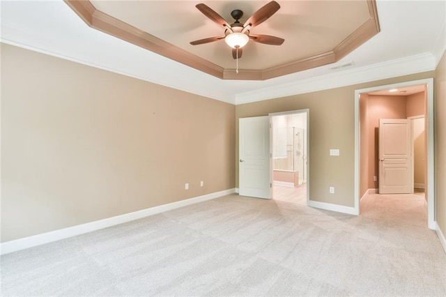 6714 Amherst Dr, Hoschton, GA 30548 - unfurnished bedroom with a tray ceiling, crown molding, light carpet, ensuite bath, and baseboards