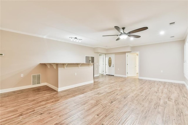 6714 Amherst Dr, Hoschton, GA 30548 - unfurnished living room with a ceiling fan, crown molding, light wood finished floors, and baseboards