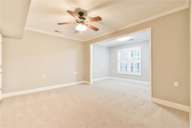 6714 Amherst Dr, Hoschton, GA 30548 - unfurnished room featuring light colored carpet, ceiling fan, baseboards, and crown molding