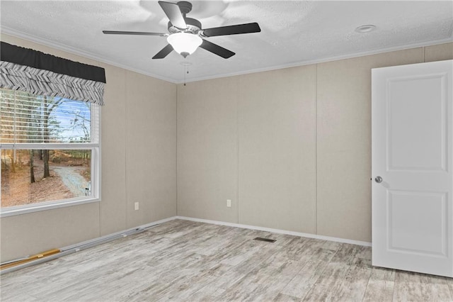 150 Saphire Hill Ct, Clarkesville, GA 30523 - spare room featuring light wood finished floors, a ceiling fan, crown molding, a textured ceiling, and baseboards