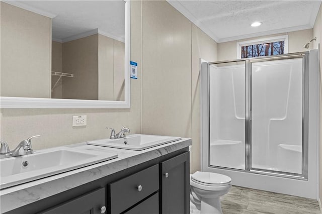 150 Saphire Hill Ct, Clarkesville, GA 30523 - full bathroom with a textured ceiling, a shower with shower door, double vanity, wood finished floors, and toilet