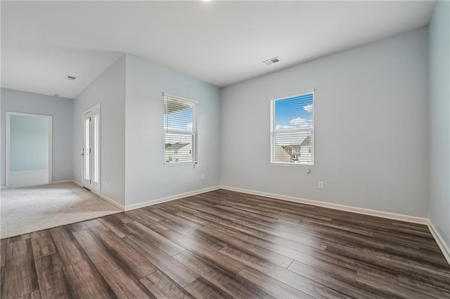 31 Mccall Way, Monroe, GA 30655 - empty room with plenty of natural light and wood finished floors