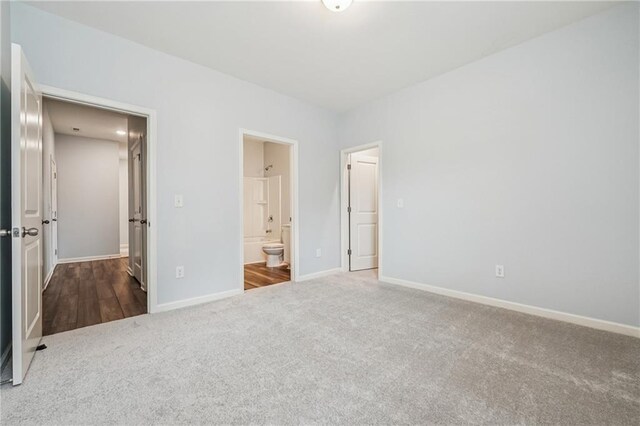31 Mccall Way, Monroe, GA 30655 - unfurnished bedroom featuring carpet floors and connected bathroom