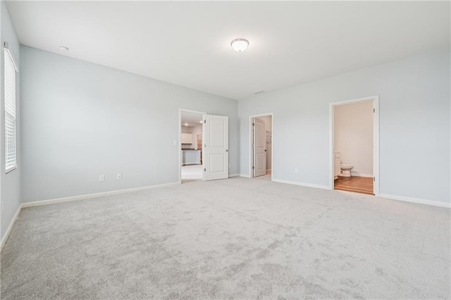 31 Mccall Way, Monroe, GA 30655 - unfurnished bedroom with carpet flooring, ensuite bathroom, and a walk in closet