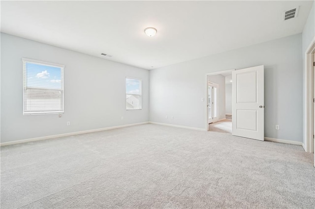 31 Mccall Way, Monroe, GA 30655 - unfurnished bedroom with multiple windows and light colored carpet