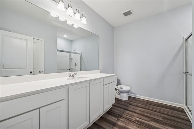 31 Mccall Way, Monroe, GA 30655 - full bathroom featuring a shower stall, vanity, and wood finished floors