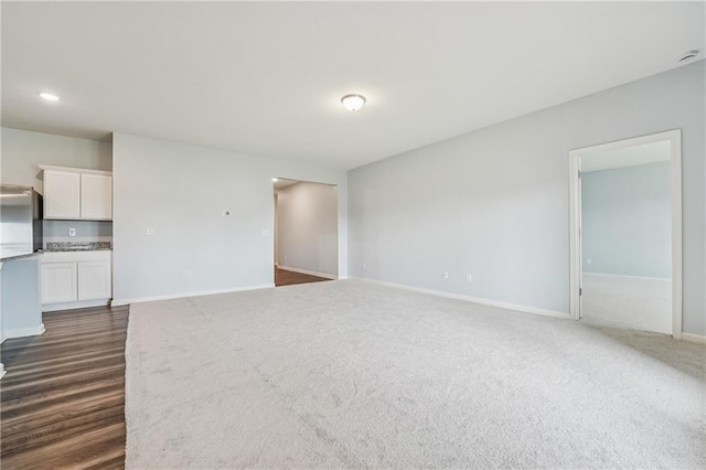 31 Mccall Way, Monroe, GA 30655 - unfurnished living room featuring dark colored carpet
