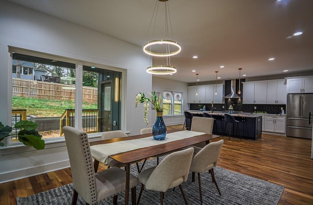 dining space featuring dark hardwood / wood-style floors