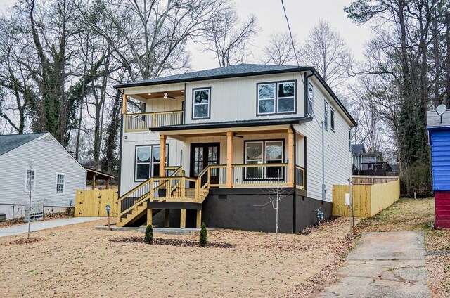 deck with covered porch and ceiling fan