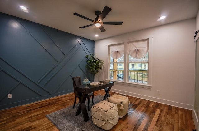 office space featuring dark wood-type flooring and ceiling fan