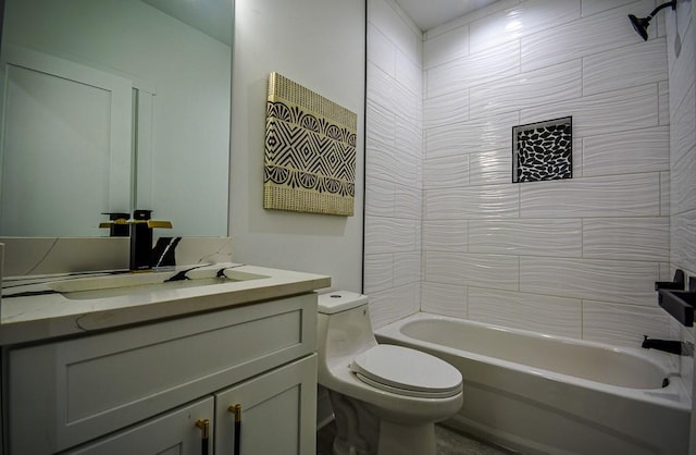 full bathroom with vanity, tiled shower / bath, and toilet