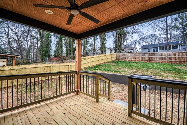 wooden deck featuring ceiling fan