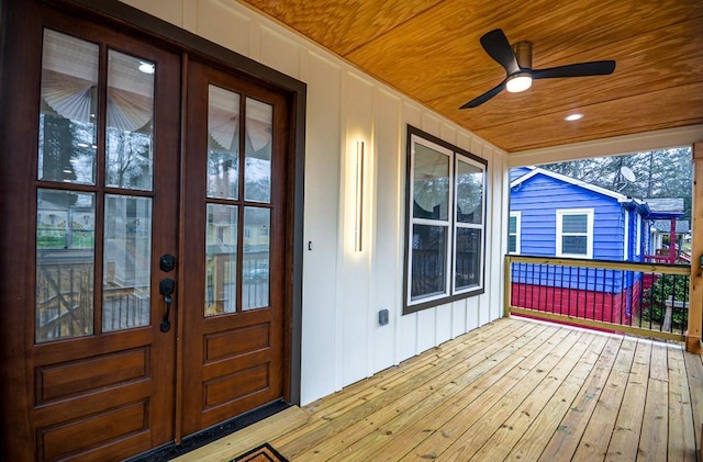 wooden deck featuring ceiling fan and a porch