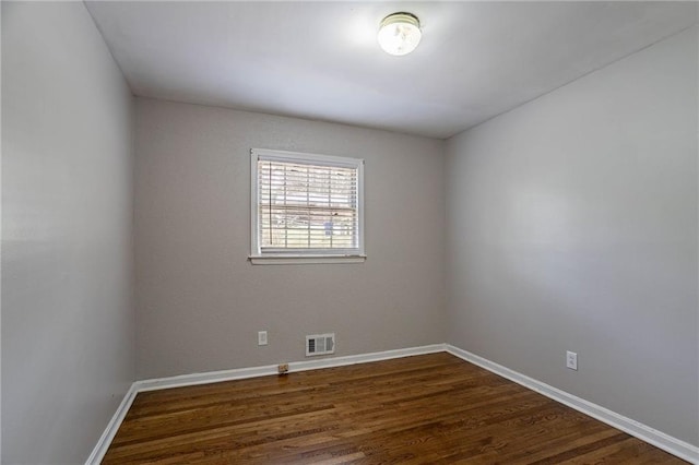 1753 Dodson Dr SW, Atlanta, GA 30311 - empty room with dark wood-type flooring, visible vents, and baseboards