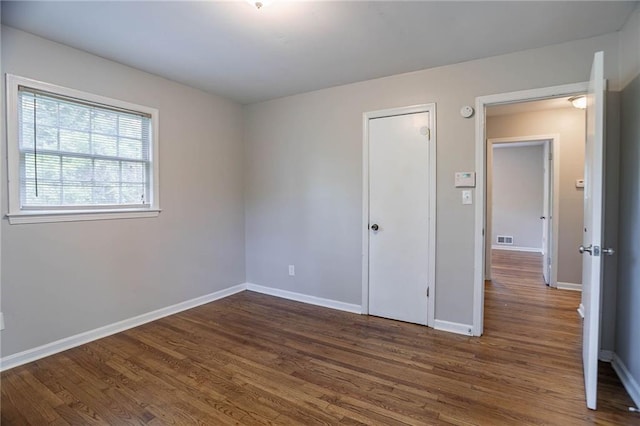 1753 Dodson Dr SW, Atlanta, GA 30311 - unfurnished bedroom featuring dark wood-type flooring, visible vents, and baseboards