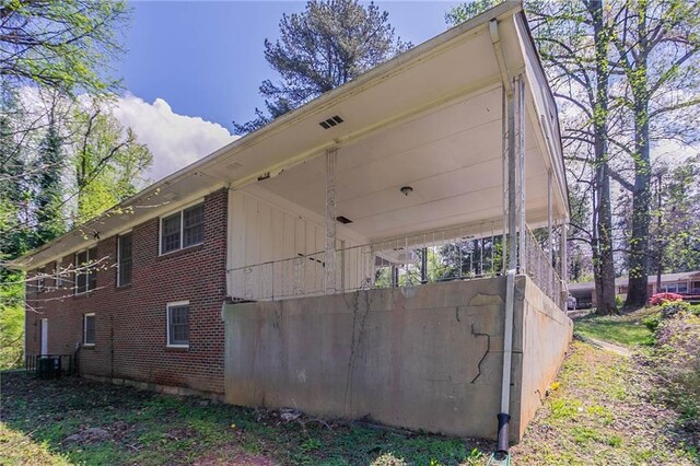 1753 Dodson Dr SW, Atlanta, GA 30311 - view of side of property featuring brick siding and central AC unit