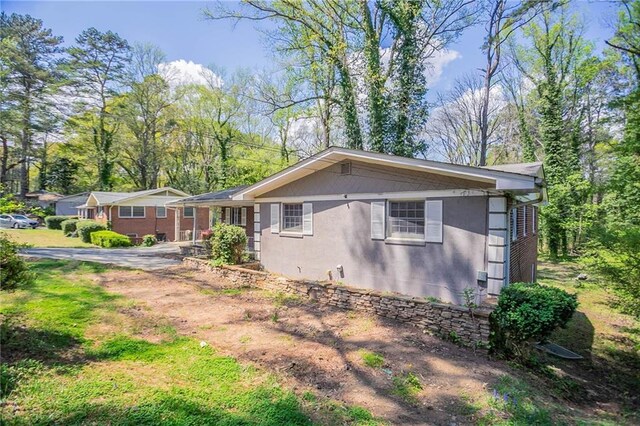 1753 Dodson Dr SW, Atlanta, GA 30311 - view of side of home with stucco siding