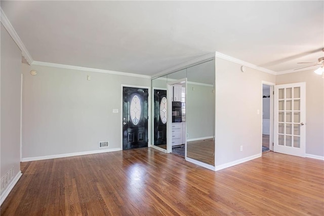 1753 Dodson Dr SW, Atlanta, GA 30311 - unfurnished room featuring visible vents, baseboards, ornamental molding, ceiling fan, and wood finished floors
