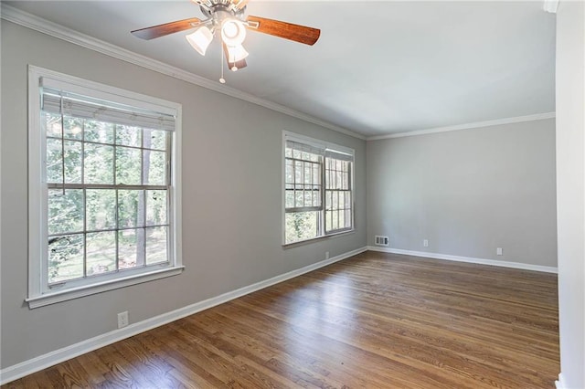 1753 Dodson Dr SW, Atlanta, GA 30311 - unfurnished room with baseboards, crown molding, a ceiling fan, dark wood-type flooring, and visible vents