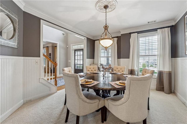 4492 Arbor Crest Ct, Suwanee, GA 30024 - dining space with wainscoting, light colored carpet, stairway, and crown molding