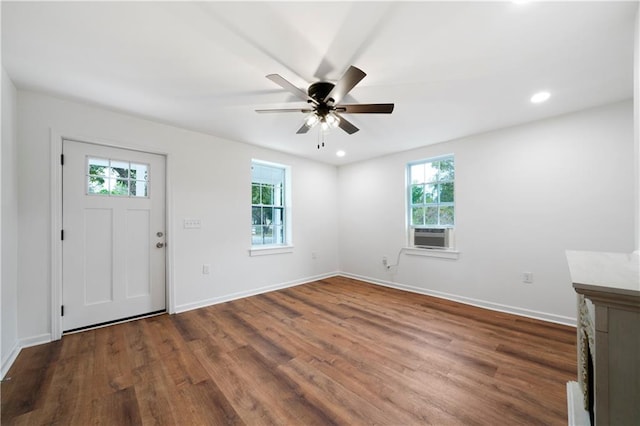 entrance foyer featuring hardwood / wood-style floors, ceiling fan, and plenty of natural light