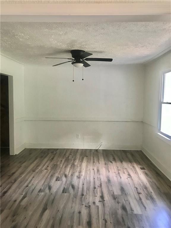 empty room featuring a textured ceiling, ceiling fan, and hardwood / wood-style floors