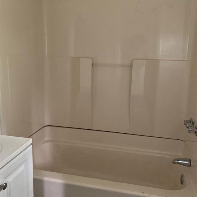 bathroom with shower / bathtub combination and vanity